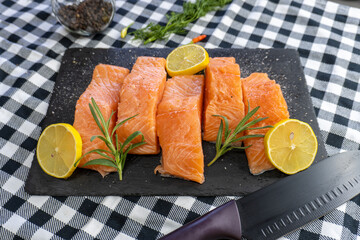 Fresh raw salmon fillet on stone plate
