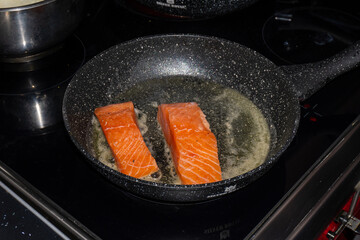 Cooking salmon steaks in the pan