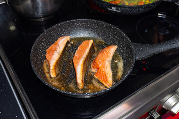 Cooking salmon steaks in the pan