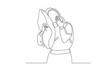 A woman who is sleeping while holding her cheek