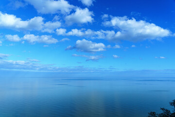 seaside ocean landscape clouded with a distant blue horizon