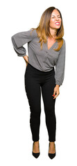 Beautiful middle age business woman Suffering of backache, touching back with hand, muscular pain