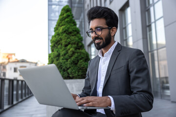 Close up of a businessman working on laptop