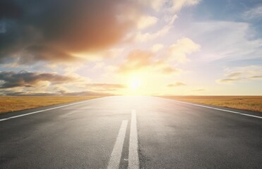 Naklejka premium Asphalt highway with beautiful view of sunset and clouds