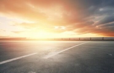 Asphalt highway with beautiful view of sunset and clouds