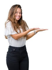 Young beautiful brunette business woman over isolated background Pointing to the side with hand and open palm, presenting ad smiling happy and confident