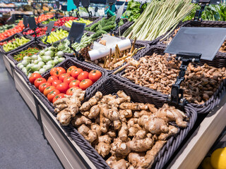 Vegetables sell in grocery store. Assorted vegetables in market with a reel of plastic pouch. 