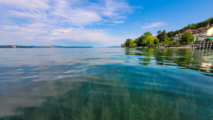 Picturesque alpine Lake Constance with clean transparent water on a sunny summer day