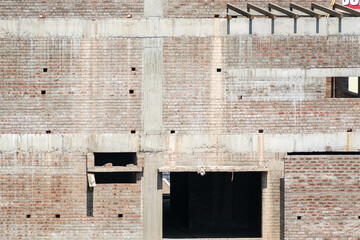 Detail of the masonry of a brick wall of a building under construction