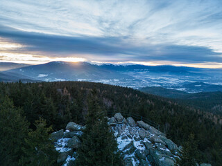 Winter panorama of the Karkonosze Mountains from the Skalnik peak in the Rudawy Janowickie mountains - sunset over the Śnieżka peak