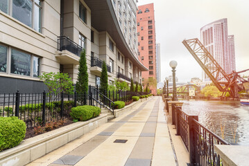 Riverside path lined with modern high rise residential buildings