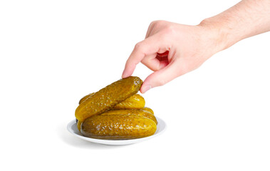 Hand Picking a Pickled Cucumber from a Plate