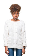 Beautiful young african american woman wearing winter sweater over isolated background depressed and worry for distress, crying angry and afraid. Sad expression.