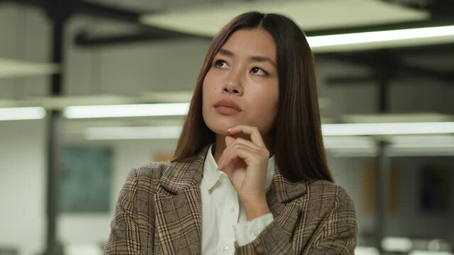 Asian girl in office Korean business woman lady Chinese businesswoman Japanese female manager worker student indoors confused pensive think thoughtful thinking puzzled solving challenge idea solution