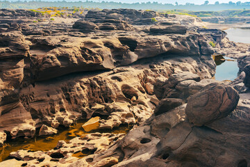 Grand Canyon in Thailand, Nature of rock canyon in Mekong River, Dry rock reef in the Mekong River with mountain hills. View of Sam Phan Bok is called Valley of Thailand. Nature landscape background.