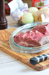 Raw beef on a cutting board ready to be cooked in the oven
