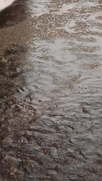 Natural River Water Flowing over Muddy Surface