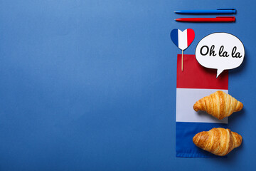 Concept of France, visual symbols of the country, on a blue background.