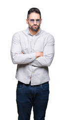 Fototapeta premium Young handsome man wearing sunglasses over isolated background skeptic and nervous, disapproving expression on face with crossed arms. Negative person.