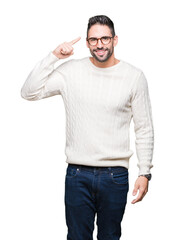 Fototapeta premium Young handsome man wearing glasses over isolated background Smiling pointing to head with one finger, great idea or thought, good memory