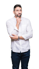 Young business man over isolated background with hand on chin thinking about question, pensive...