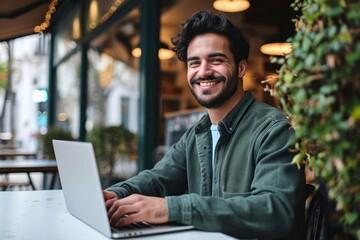 Smiling young Latin business man using laptop sitting outdoor. Happy guy student or professional looking away in city cafe elearning, hybrid working, searching job online thinking, Generative AI - obrazy, fototapety, plakaty