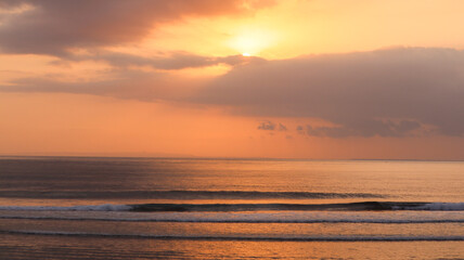 Fototapeta na wymiar Beautiful sunset over the sea in Pecatu Bali Indonesia