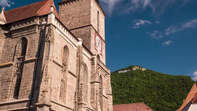 Establishing shot of old town Brasov Romania, Eastern European town. Smooth tracking shot of old buildings. Beautiful sunny morning. Good for establishing shot, video opening or closing