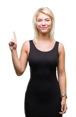 Fototapeta premium Young beautiful blonde attractive woman wearing elegant dress over isolated background showing and pointing up with finger number one while smiling confident and happy.