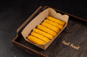 Delicious fast food golden fried nuggets in a cardboard box for takeaway