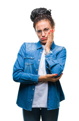 Young braided hair african american girl wearing glasses over isolated background thinking looking tired and bored with depression problems with crossed arms.