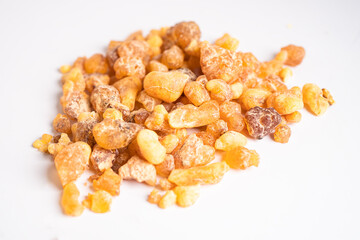 Frankincense or olibanum aromatic resin isolated on white background used in incense and perfumes.