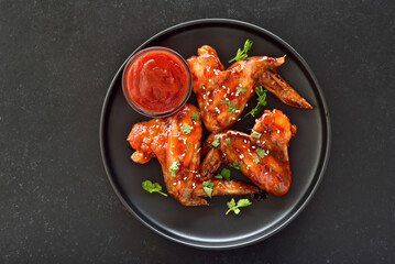 Baked chicken wings on plate