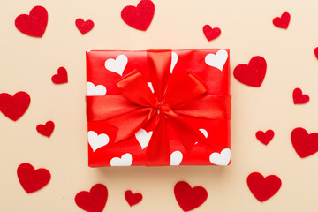 Gift box with hearts on color background, top view. Valentines day concept