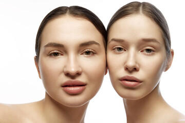 Close up portrait of two well maintained girls, young women, friends with natural make-up looking...