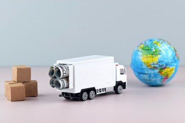 White toy truck with boxes on a light background, space for text.
