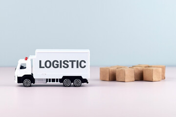 White toy truck on blocks with the text LOGISTIC.