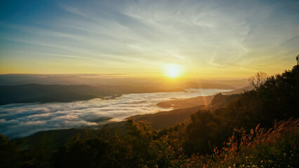 Morning fog at doi samer dao at Sri Nan national park, Thailand. Beautiful landscape Sea fog or sea of cloud view in the morning. Sunbeam in the mountains and mist.