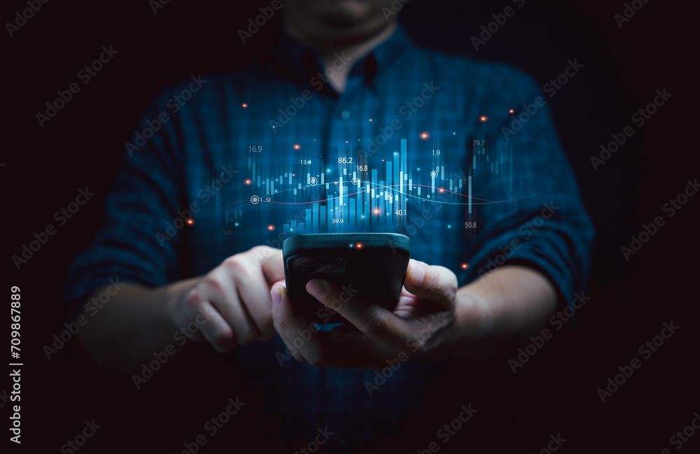 Aufkleber businessman holding smartphone with virtual technical graph and chart for analysis stock market, tra