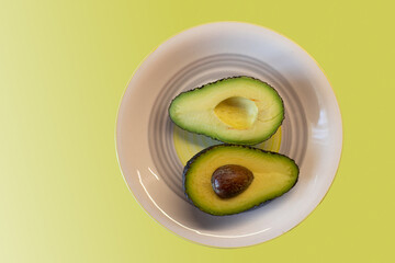 nice ripe avocado on background.avocado cut in half.avocado halves.healthy...