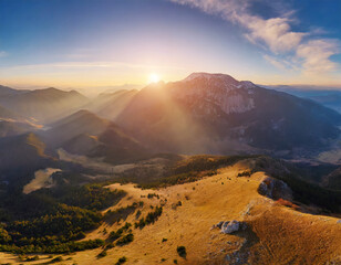 Fototapeta premium An epic sunrise in the mountains; aerial view; panorama landscape