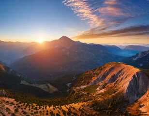 An epic sunrise in the mountains; aerial view; panorama landscape
