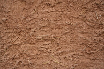 Texture of a wall made using red clay