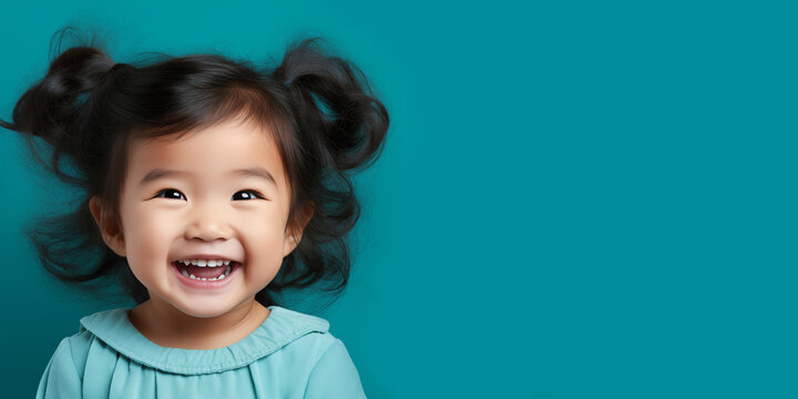 Banner with cute smiling chinese girl with empty space for text over teal background