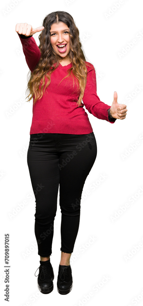 Sticker young beautiful woman wearing red sweater approving doing positive gesture with hand, thumbs up smil