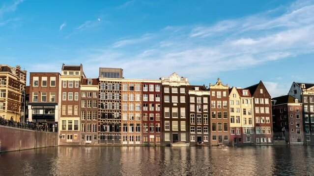 Amsterdam Netherlands time lapse 4K, city skyline timelapse at Damrak canal waterfront