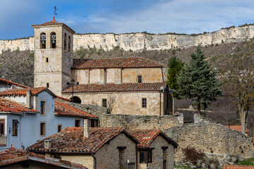 Traditional buildings and Church of San Pelayo, Puentedey, Burgos, Castilla y León, Spain.