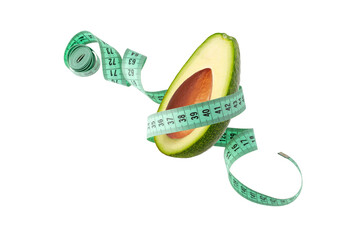Green avocado and measuring tape flying isolated on white background. Symbol of healthy dieting and...