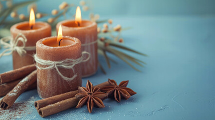 Fototapeta na wymiar cinnamon scented candles on a mint background 