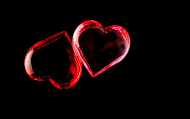 red and pink hearts outline halo isolated on a black background
